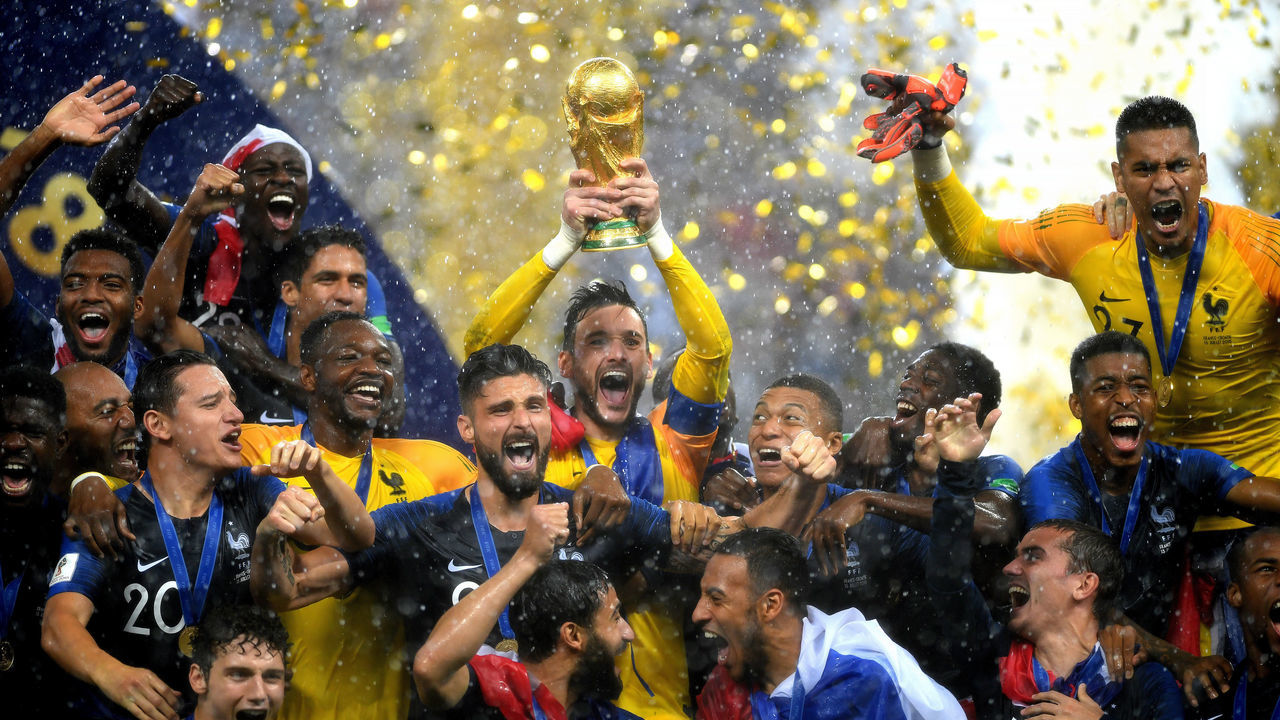 MOSCOW, RUSSIA - JULY 15: Hugo Lloris of France lifts the World Cup trophy to celebrate with his teammates after the 2018 FIFA World Cup Final between France and Croatia at Luzhniki Stadium on July 15, 2018 in Moscow, Russia.