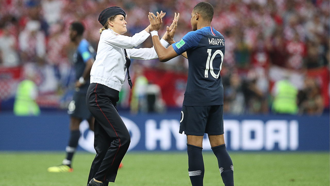 MOSCOW, RUSSIA JULY 15, 2018: A pitch invader high fives France's Kylian Mbappe during the 2018 FIFA World Cup final football match between France and Croatia at Luzhniki Stadium. Sergei Bobylev/TASS