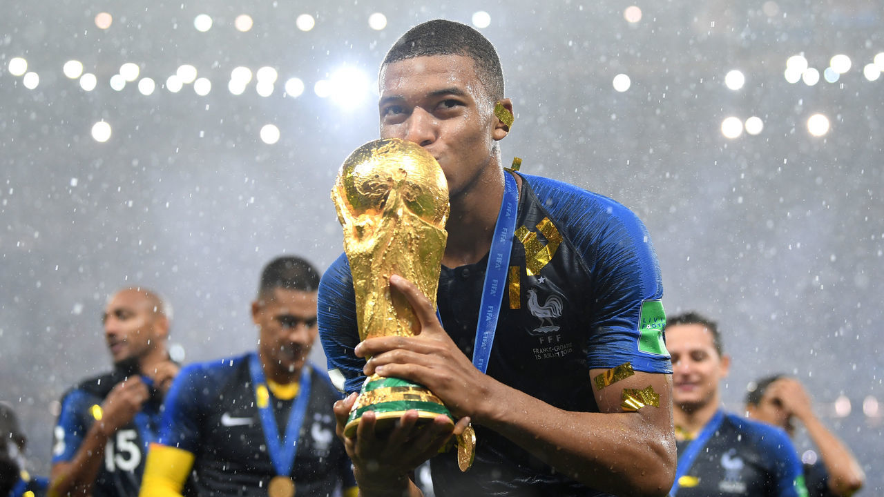 MOSCOW, RUSSIA - JULY 15: Kylian Mbappe of France celebrates with the World Cup trophy following the 2018 FIFA World Cup Final between France and Croatia at Luzhniki Stadium on July 15, 2018 in Moscow, Russia.