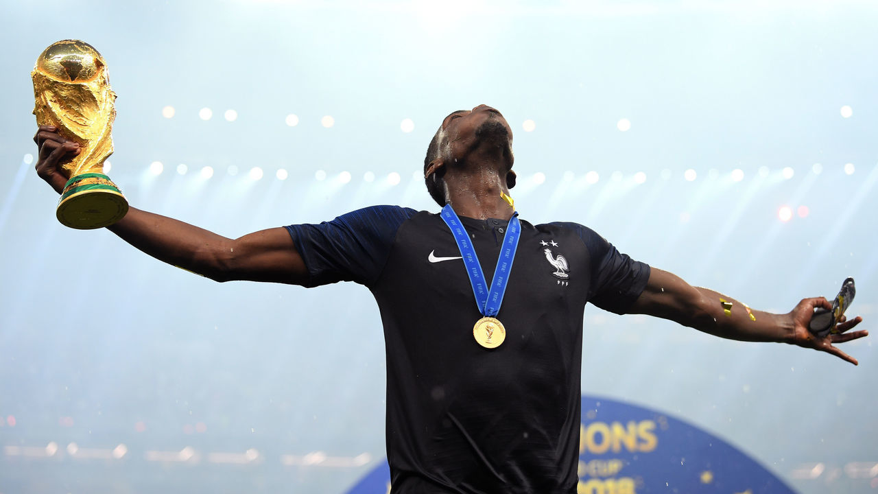 MOSCOW, RUSSIA - JULY 15: Paul Pogba of France celebrates with the World Cup Trophy following his sides victory in the 2018 FIFA World Cup Final between France and Croatia at Luzhniki Stadium on July 15, 2018 in Moscow, Russia.