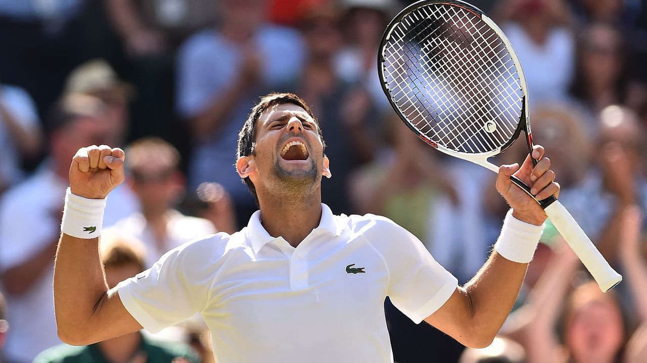 TOPSHOT - Serbia's Novak Djokovic celebrates after beating South Africa's Kevin Anderson 6-2, 6-2, 7-6 in their men's singles final match on the thirteenth day of the 2018 Wimbledon Championships at The All England Lawn Tennis Club in Wimbledon, southwest London, on July 15, 2018.