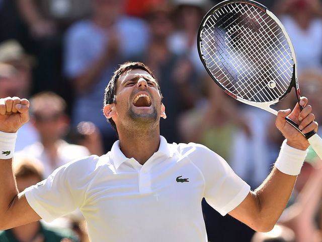 TOPSHOT - Serbia's Novak Djokovic celebrates after beating South Africa's Kevin Anderson 6-2, 6-2, 7-6 in their men's singles final match on the thirteenth day of the 2018 Wimbledon Championships at The All England Lawn Tennis Club in Wimbledon, southwest London, on July 15, 2018.