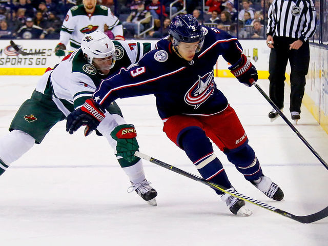 COLUMBUS, OH - JANUARY 30: Artemi Panarin #9 of the Columbus Blue Jackets attempts to keep Matt Cullen #7 of the Minnesota Wild away from the puck during the second period on January 30, 2018 at Nationwide Arena in Columbus, Ohio.