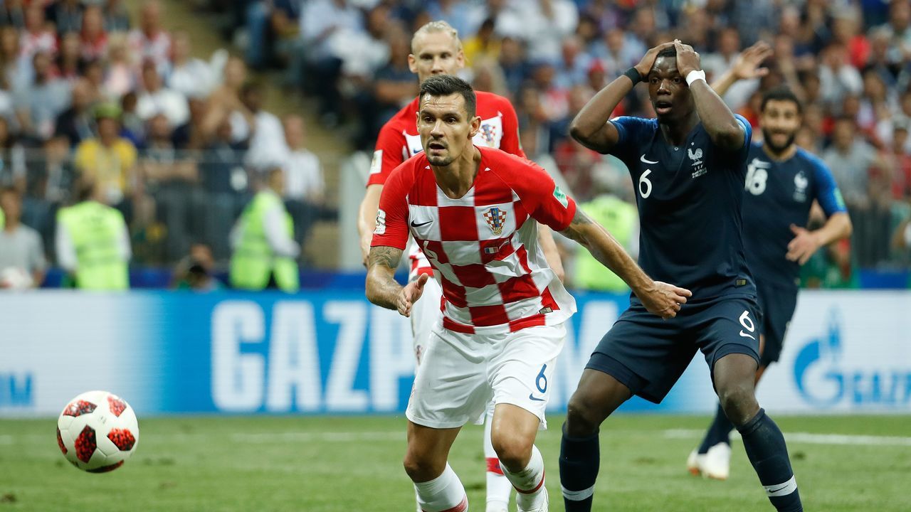 France's midfielder Paul Pogba reacts as the ball goes wide past Croatia's defender Dejan Lovren during the Russia 2018 World Cup final football match between France and Croatia at the Luzhniki Stadium in Moscow on July 15, 2018.