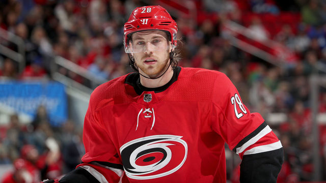 RALEIGH, NC - APRIL 7: Elias Lindholm #28 of the Carolina Hurricanes prepares for a faceoff during an NHL game against the Tampa Bay Lightning on April 7, 2018 at PNC Arena in Raleigh, North Carolina.