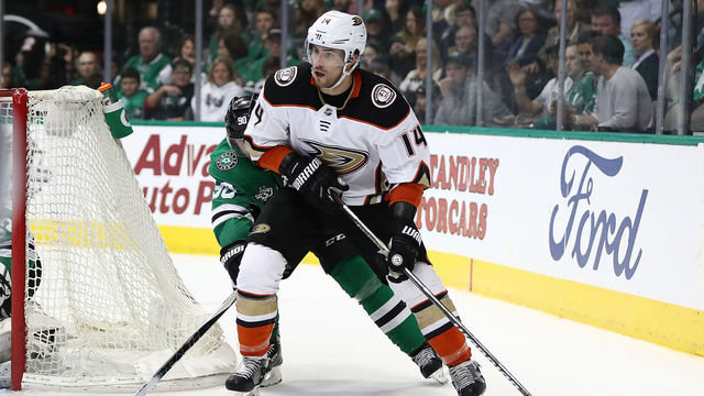 DALLAS, TX - MARCH 09: Adam Henrique #14 of the Anaheim Ducks skates the puck against the Dallas Stars during the second period at American Airlines Center on March 9, 2018 in Dallas, Texas.