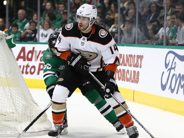 DALLAS, TX - MARCH 09: Adam Henrique #14 of the Anaheim Ducks skates the puck against the Dallas Stars during the second period at American Airlines Center on March 9, 2018 in Dallas, Texas.