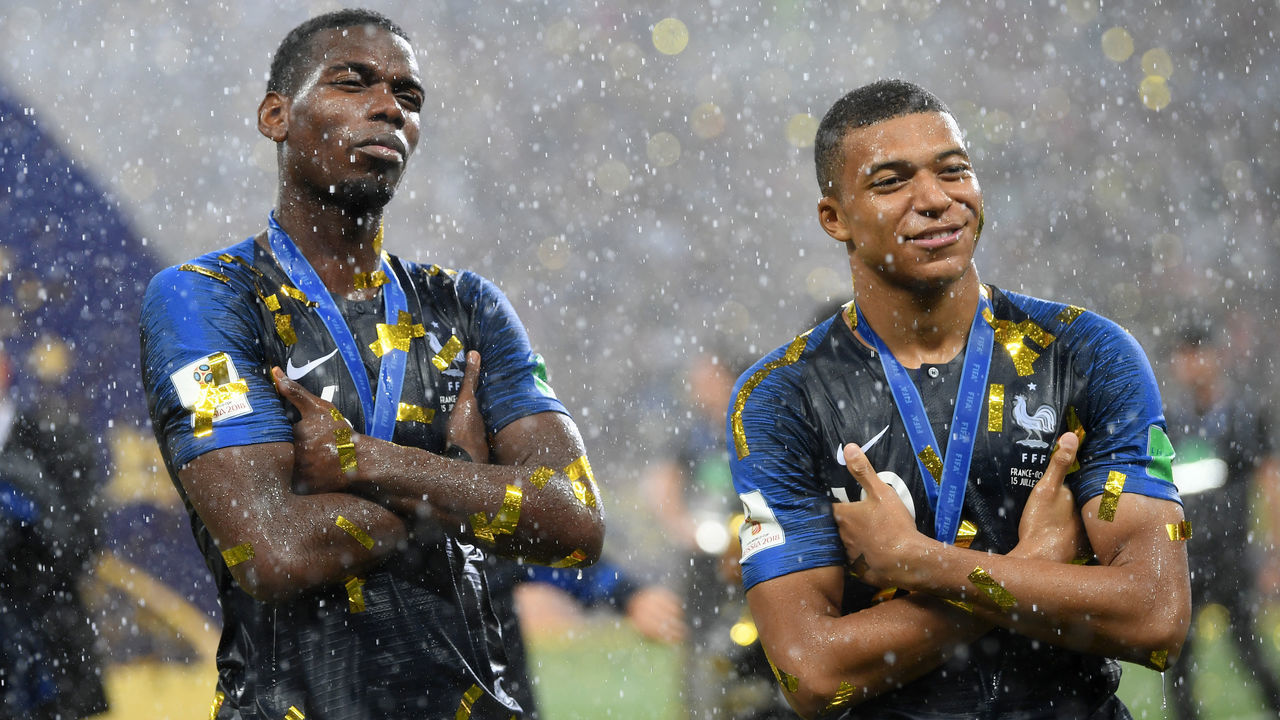 MOSCOW, RUSSIA - JULY 15: Paul Pogba and Kylian Mbappe of France celebrate victory following the 2018 FIFA World Cup Final between France and Croatia at Luzhniki Stadium on July 15, 2018 in Moscow, Russia.