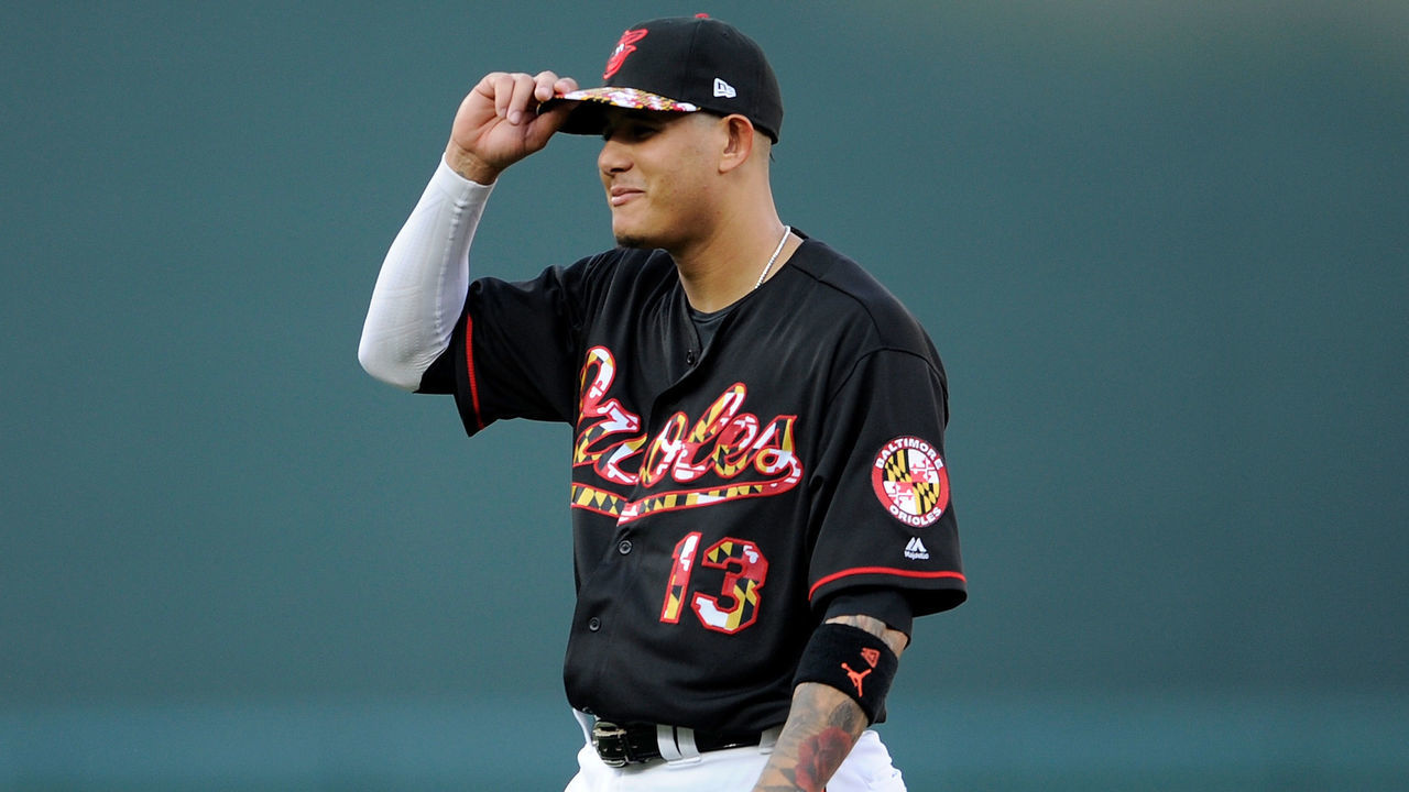 BALTIMORE, MD - JULY 14: Manny Machado #13 of the Baltimore Orioles warms up before the game against the Texas Rangers at Oriole Park at Camden Yards on July 14, 2018 in Baltimore, Maryland.