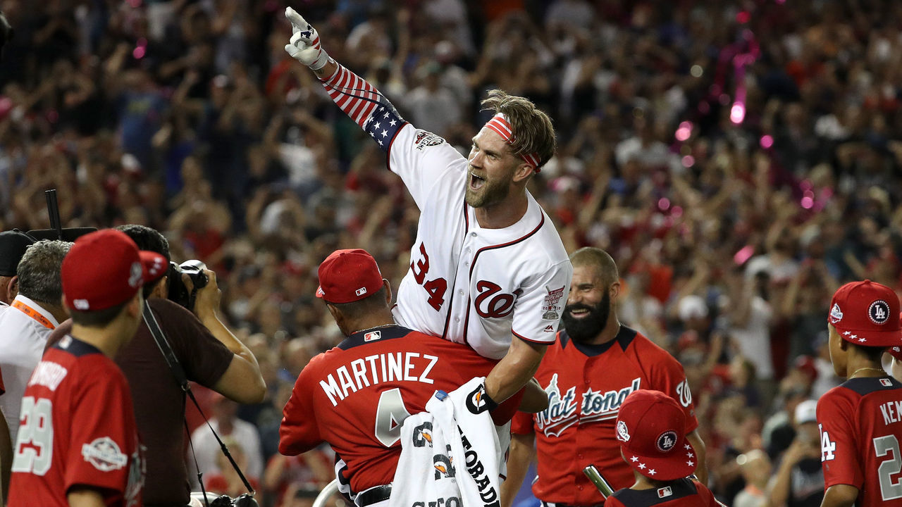 WASHINGTON, DC - JULY 16: Bryce Harper of the Washington Nationals and National League celebrates with his manager Dave Martinez and father Ron Harper after winning the T-Mobile Home Run Derby at Nationals Park on July 16, 2018 in Washington, DC. Harper defeated Kyle Schwarber of the Chicago Cubs and National League 19-18.
