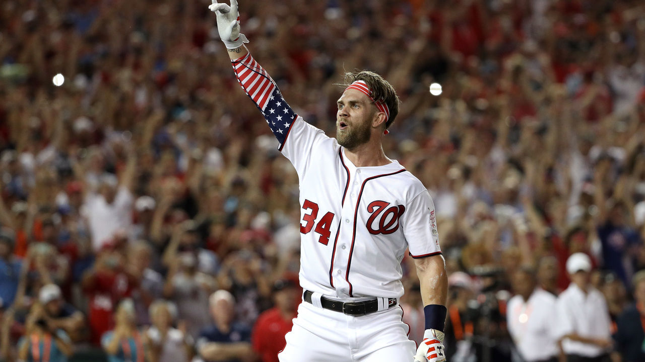 WASHINGTON, DC - JULY 16: Bryce Harper of the Washington Nationals and National League celebrates after winning the T-Mobile Home Run Derby at Nationals Park on July 16, 2018 in Washington, DC. Harper defeated Kyle Schwarber of the Chicago Cubs and National League 19-18.