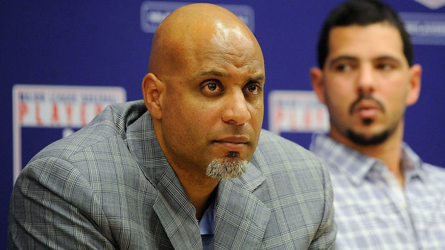 NEW YORK, NY - NOVEMBER 22: Tony Clark (L) and Carlos Villanueva listen as Major League Baseball Commissioner Bud Selig speaks at a news conference at MLB headquarters on November 22, 2011 in New York City. Selig announced a new five-year labor agreement between Major League Baseball and the Major League Baseball Players Association.