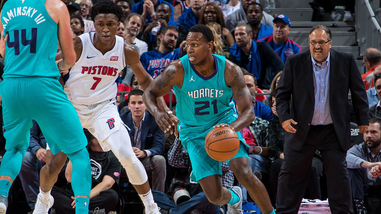 DETROIT, MI - OCTOBER 18: Treveon Graham #21 of the Charlotte Hornets \drives the basket next to Stanley Johnson #7 of the Detroit Pistons during the Inaugural NBA game at the new Little Caesars Arena on October 18, 2017 in Detroit, Michigan. The Pistons defeated the Hornets 102 to 90.