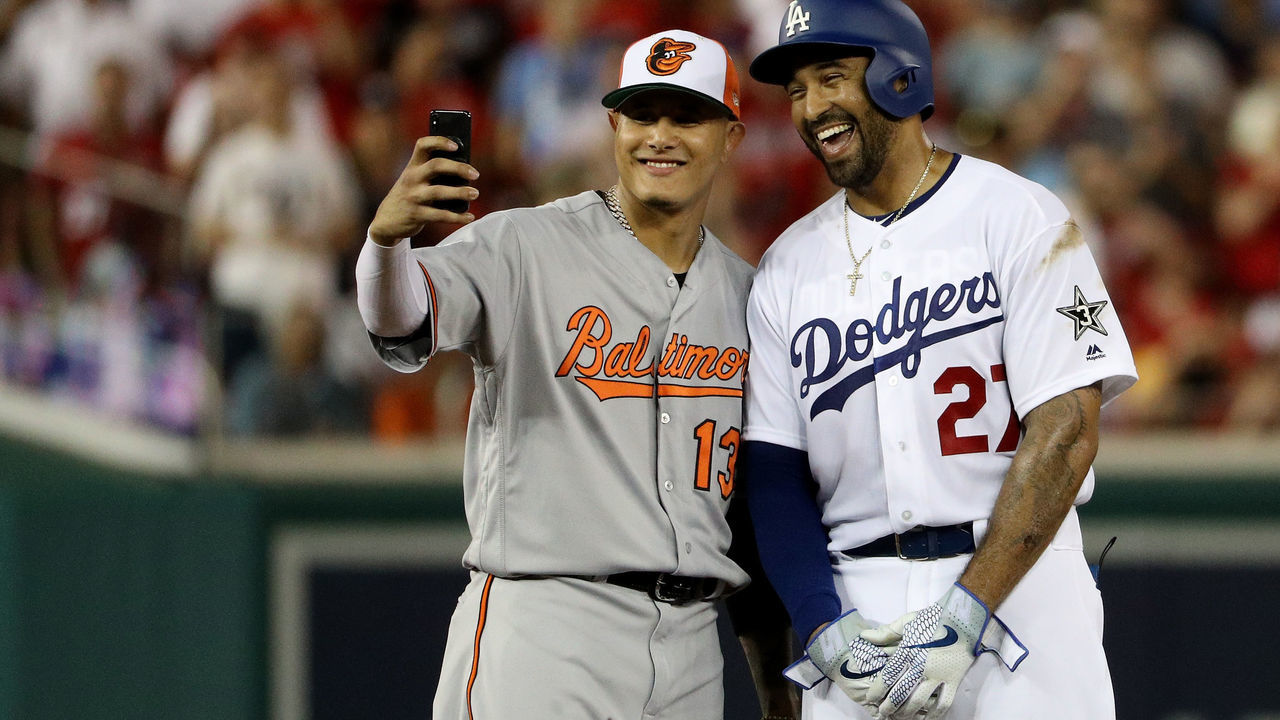 WASHINGTON, DC - JULY 17: Manny Machado #13 of the Baltimore Orioles and the American League and Matt Kemp #27 of the Los Angeles Dodgers and the National League pose for a selfie in the second inning during the 89th MLB All-Star Game, presented by Mastercard at Nationals Park on July 17, 2018 in Washington, DC.