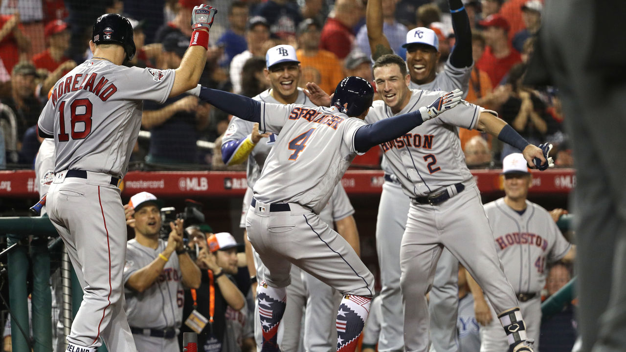 WASHINGTON, DC - JULY 17: George Springer #4 of the Houston Astros and the American League celebrates with teammates after hitting a solo home run in the tenth inning against the National League during the 89th MLB All-Star Game, presented by Mastercard at Nationals Park on July 17, 2018 in Washington, DC.