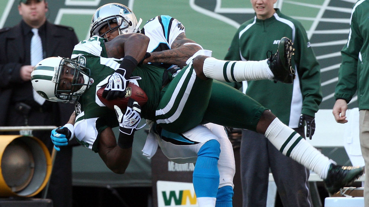 EAST RUTHERFORD, NJ - NOVEMBER 29: Darrelle Revis #24 of the New York Jets intercepts a pass intended for Steve Smith #89 of the Carolina Panthers during the second quarter on November 29, 2009 at Giants Stadium in East Rutherford, New Jersey.