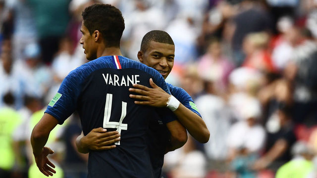 France's forward Kylian Mbappe (L) greets France's defender Raphael Varane at the end of the Russia 2018 World Cup round of 16 football match between France and Argentina at the Kazan Arena in Kazan on June 30, 2018.