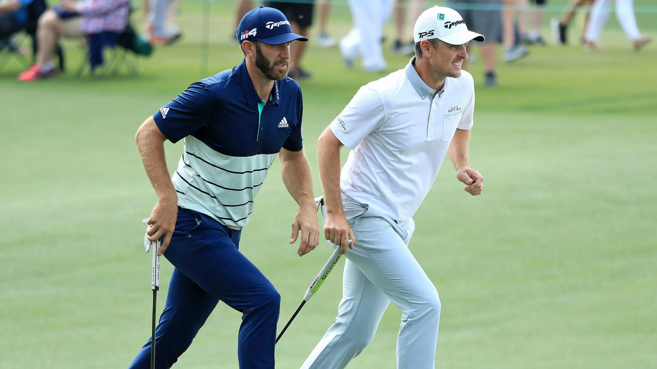 AUGUSTA, GA - APRIL 06: (L-R) Dustin Johnson of the United States and Justin Rose of England walk up the 18th hole during the second round of the 2018 Masters Tournament at Augusta National Golf Club on April 6, 2018 in Augusta, Georgia.