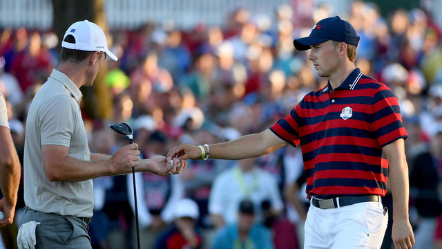 CHASKA, MN - OCTOBER 01: Jordan Spieth of the United States hands a ball back to Justin Rose of Europe on the 17th hole during afternoon fourball matches of the 2016 Ryder Cup at Hazeltine National Golf Club on October 1, 2016 in Chaska, Minnesota.