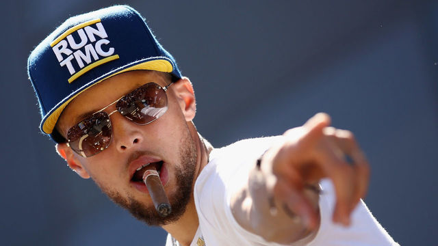 OAKLAND, CA - JUNE 12: Stephen Curry #30 of the Golden State Warriors points to the crowd during the Golden State Warriors Victory Parade on June 12, 2018 in Oakland, California. The Golden State Warriors beat the Cleveland Cavaliers 4-0 to win the 2018 NBA Finals.