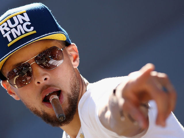 OAKLAND, CA - JUNE 12: Stephen Curry #30 of the Golden State Warriors points to the crowd during the Golden State Warriors Victory Parade on June 12, 2018 in Oakland, California. The Golden State Warriors beat the Cleveland Cavaliers 4-0 to win the 2018 NBA Finals.