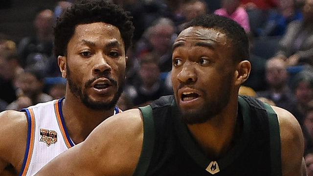 MILWAUKEE, WI - JANUARY 06: Jabari Parker #12 of the Milwaukee Bucks drives around Derrick Rose #25 of the New York Knicks during a game at BMO Harris Bradley Center on January 6, 2017 in Milwaukee, Wisconsin.