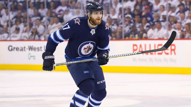WINNIPEG, MB - MAY 14: Adam Lowry #17 of the Winnipeg Jets follows the play down the ice during first period action against the Vegas Golden Knights in Game Two of the Western Conference Final during the 2018 NHL Stanley Cup Playoffs at the Bell MTS Place on May 14, 2018 in Winnipeg, Manitoba, Canada. The Knights defeated the Jets 3-1 to tie the series 1-1.