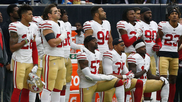 HOUSTON, TX - DECEMBER 10: Several San Francisco 49ers take a knee during the National Anthem before the game against the Houston Texans at NRG Stadium on December 10, 2017 in Houston, Texas.