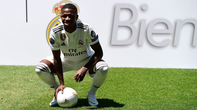 Real Madrid's new Brazilian forward Vinicius Junior poses on the pitch during his official presentation at the Santiago Bernabeu Stadium in Madrid on July 20, 2018.