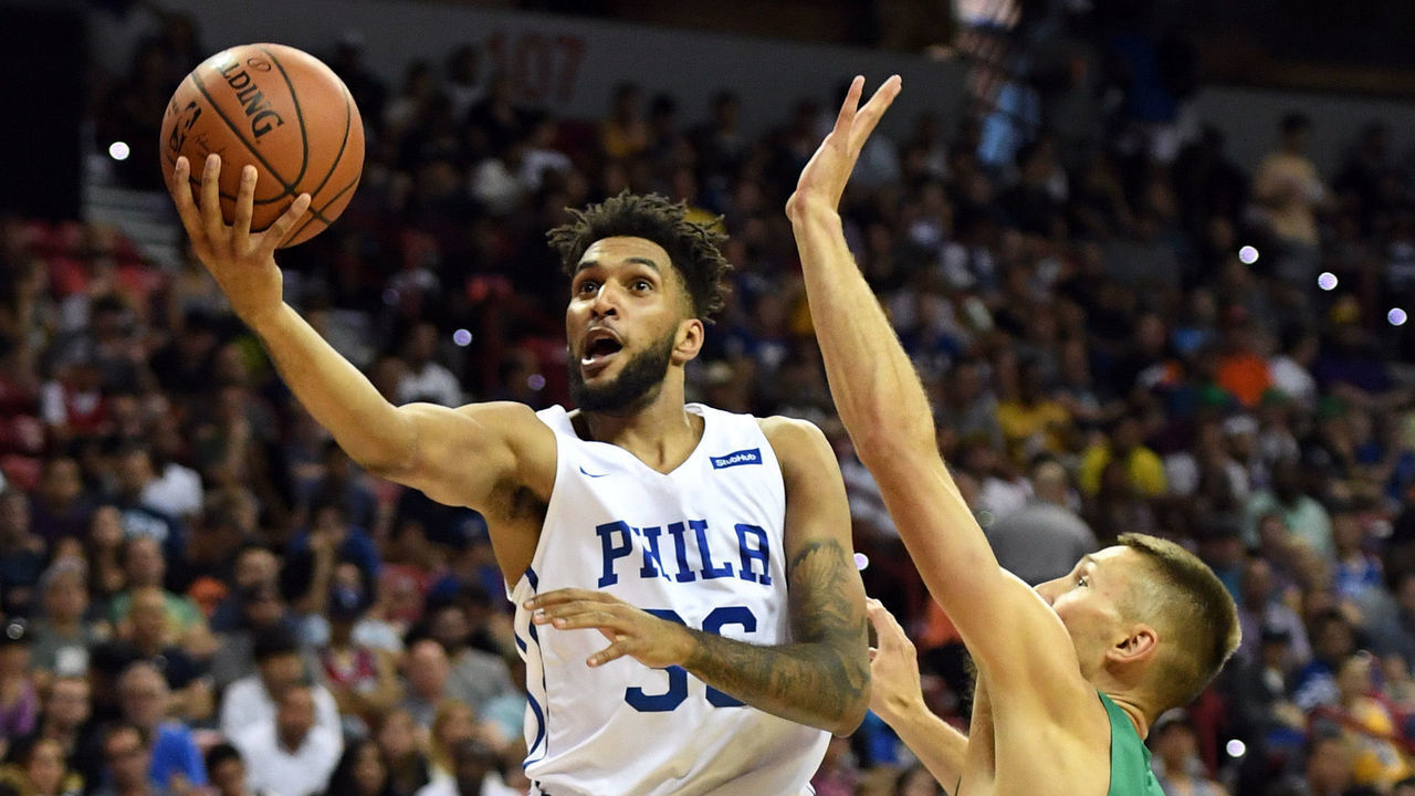 LAS VEGAS, NV - JULY 06: Jonah Bolden #36 of the Philadelphia 76ers drives to the basket against Jarrod Uthoff #64 of the Boston Celtics during the 2018 NBA Summer League at the Thomas & Mack Center on July 6, 2018 in Las Vegas, Nevada.