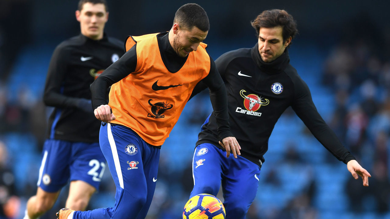 MANCHESTER, ENGLAND - MARCH 04: Eden Hazard and Cesc Fabregas of Chelsea warm up during the Premier League match between Manchester City and Chelsea at Etihad Stadium on March 4, 2018 in Manchester, England.