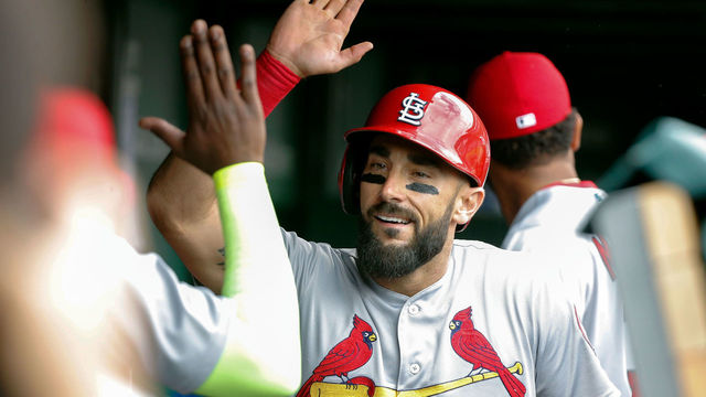 CHICAGO, IL - JULY 20: Matt Carpenter #13 of the St. Louis Cardinals is congratulated in the dugout after hitting a home run against the Chicago Cubs during the first inning at Wrigley Field on July 20, 2018 in Chicago, Illinois.