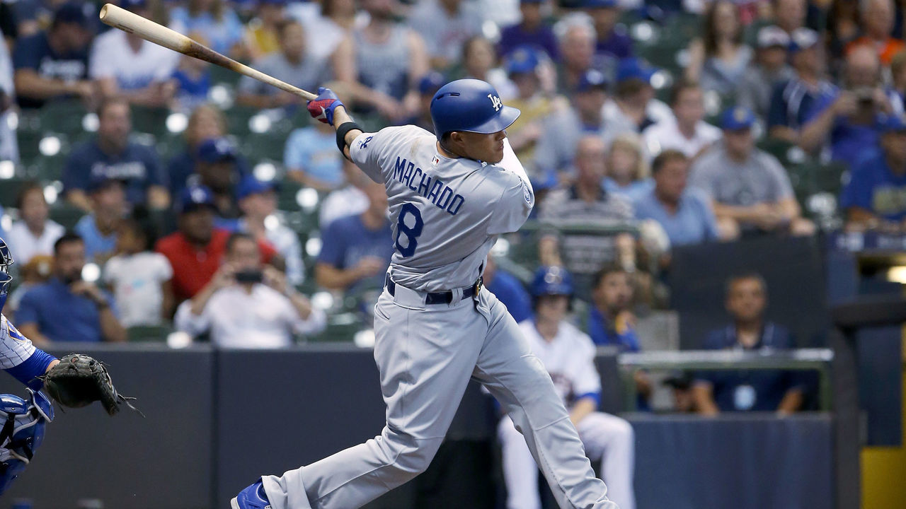 MILWAUKEE, WI - JULY 20: Manny Machado #8 of the Los Angeles Dodgers hits a single in the first inning against the Milwaukee Brewers at Miller Park on July 20, 2018 in Milwaukee, Wisconsin.