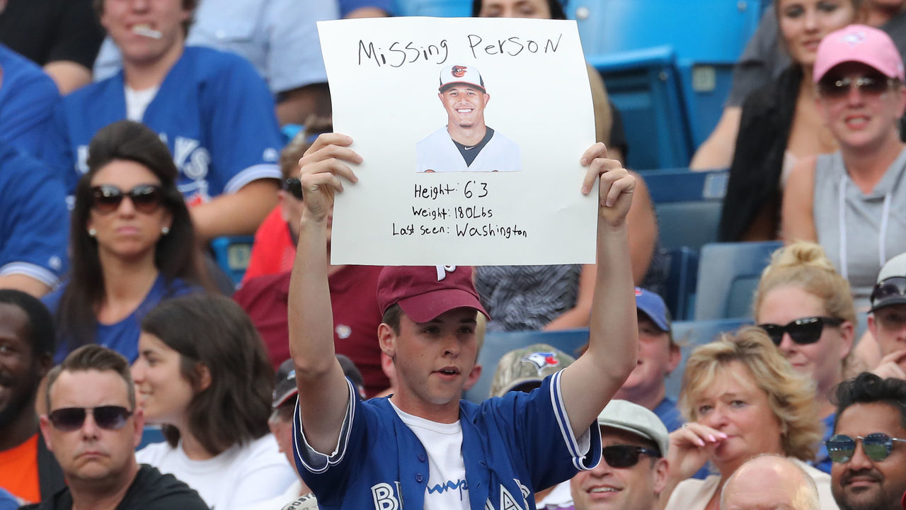 TORONTO, ON - JULY 20: A fan holds up a sign referencing the trade of Manny Machado #13 of the Baltimore Orioles before todays MLB game against the Toronto Blue Jays at Rogers Centre on July 20, 2018 in Toronto, Canada.