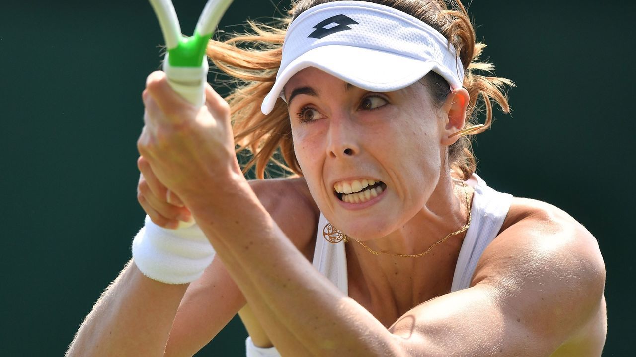 France's Alize Cornet returns to Slovakia's Dominika Cibulkova during their women's singles first round match on the second day of the 2018 Wimbledon Championships at The All England Lawn Tennis Club in Wimbledon, southwest London, on July 3, 2018.