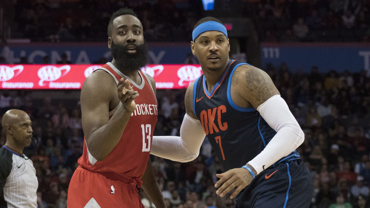 OKLAHOMA CITY, OK - DECEMBER 25: James Harden #13 of the Houston Rockets and Carmelo Anthony #7 of the Oklahoma City Thunder during the second half of a NBA game at the Chesapeake Energy Arena on December 25, 2017 in Oklahoma City, Oklahoma. The Thunder defeated the Rockets 112-107.
