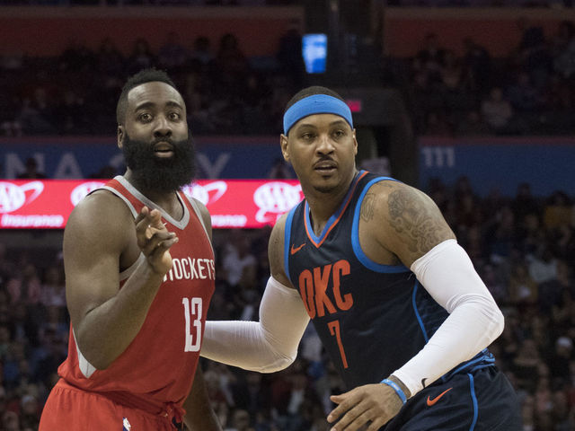 OKLAHOMA CITY, OK - DECEMBER 25: James Harden #13 of the Houston Rockets and Carmelo Anthony #7 of the Oklahoma City Thunder during the second half of a NBA game at the Chesapeake Energy Arena on December 25, 2017 in Oklahoma City, Oklahoma. The Thunder defeated the Rockets 112-107.