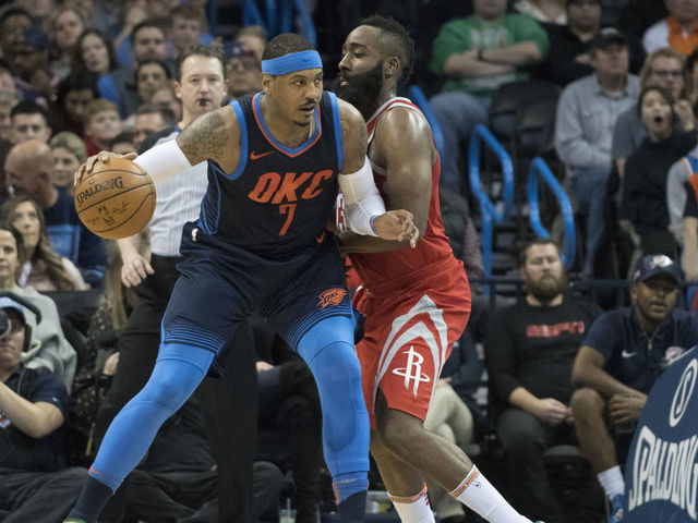 OKLAHOMA CITY, OK - DECEMBER 25: James Harden #13 of the Houston Rockets blocks Carmelo Anthony #7 of the Oklahoma City Thunder during the second half of a NBA game at the Chesapeake Energy Arena on December 25, 2017 in Oklahoma City, Oklahoma. The Thunder defeated the Rockets 112-107.