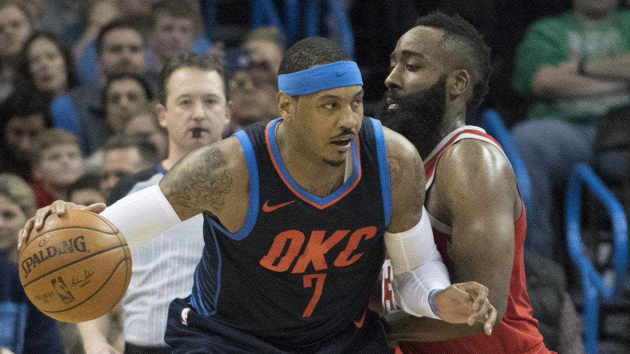 OKLAHOMA CITY, OK - DECEMBER 25: James Harden #13 of the Houston Rockets blocks Carmelo Anthony #7 of the Oklahoma City Thunder during the second half of a NBA game at the Chesapeake Energy Arena on December 25, 2017 in Oklahoma City, Oklahoma. The Thunder defeated the Rockets 112-107.