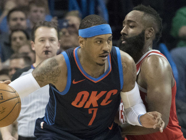 OKLAHOMA CITY, OK - DECEMBER 25: James Harden #13 of the Houston Rockets blocks Carmelo Anthony #7 of the Oklahoma City Thunder during the second half of a NBA game at the Chesapeake Energy Arena on December 25, 2017 in Oklahoma City, Oklahoma. The Thunder defeated the Rockets 112-107.