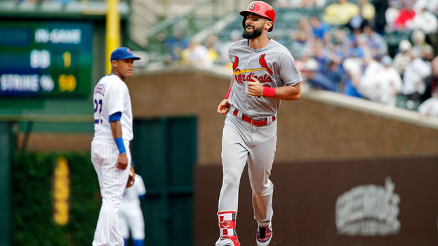 CHICAGO, IL - JULY 20: Matt Carpenter #13 of the St. Louis Cardinals rounds the bases after hitting a three run home run as Addison Russell #27 of the Chicago Cubs looks on during the sixth inning at Wrigley Field on July 20, 2018 in Chicago, Illinois. This was the third home run for Matt Carpenter of the game.