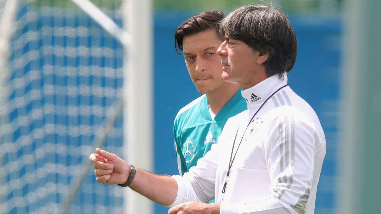 MOSCOW, RUSSIA - JUNE 13: Joachim Loew, head coach of Germany talks to his palyer Mesut Oezil during the Germany training session ahead of the 2018 FIFA World Cup at CSKA Sports Base on June 13, 2018 in Moscow, Russia.