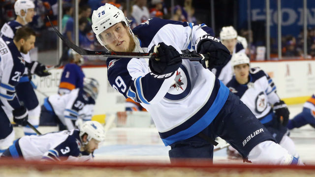 NEW YORK, NY - DECEMBER 23: Patrik Laine #29 of the Winnipeg Jets takes the shot in warm ups prior to the game against the New York Islanders at the Barclays Center on December 23, 2017 in the Brooklyn borough of New York City.