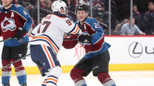 DENVER, CO - FEBRUARY 18: Connor McDavid #97 of the Edmonton Oilers skates against Nathan MacKinnon #29 of the Colorado Avalanche at the Pepsi Center on February 18, 2018 in Denver, Colorado. The Oilers defeated the Avalanche 4-2.
