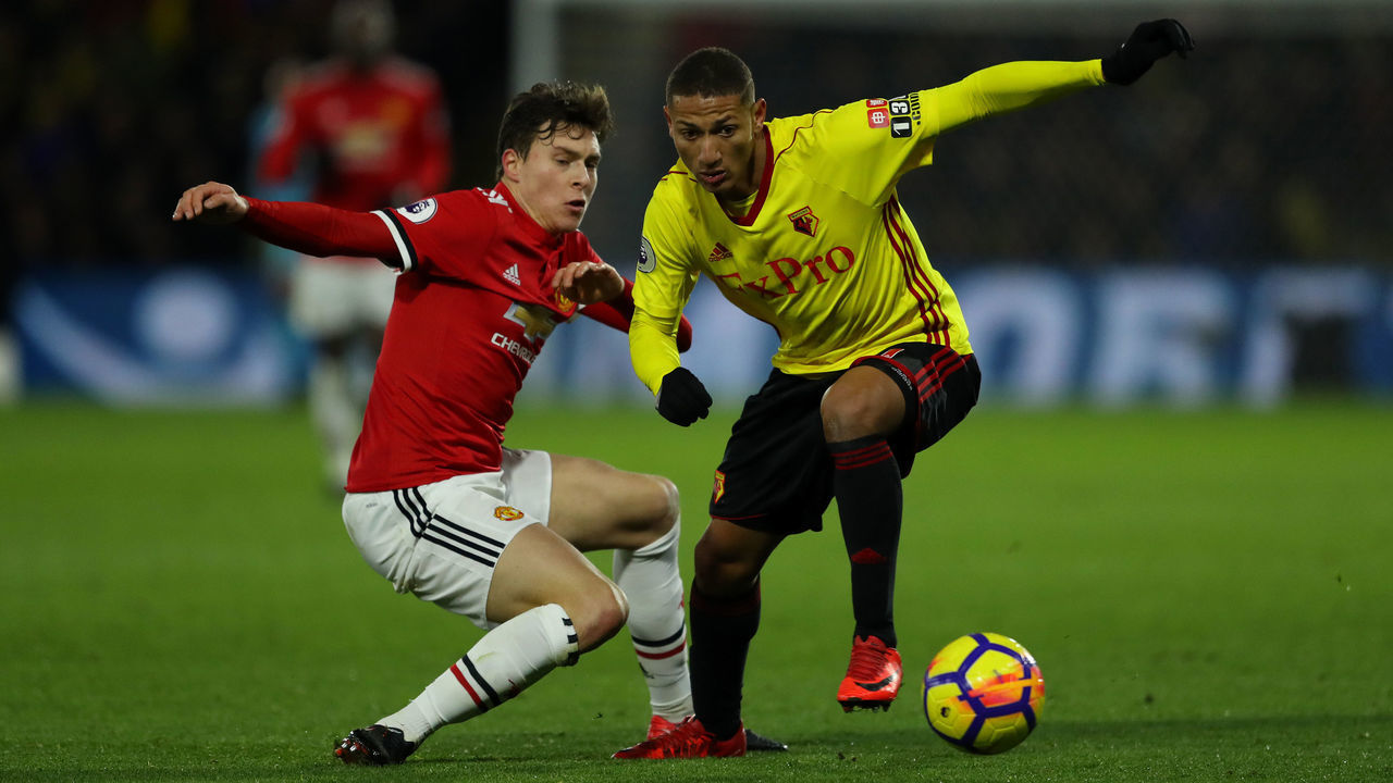 WATFORD, ENGLAND - NOVEMBER 28: Richarlison of Watford goes past Victor Lindelof of Manchester United during the Premier League match between Watford and Manchester United at Vicarage Road on November 28, 2017 in Watford, England.