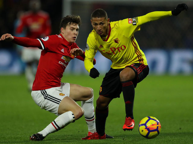 WATFORD, ENGLAND - NOVEMBER 28: Richarlison of Watford goes past Victor Lindelof of Manchester United during the Premier League match between Watford and Manchester United at Vicarage Road on November 28, 2017 in Watford, England.
