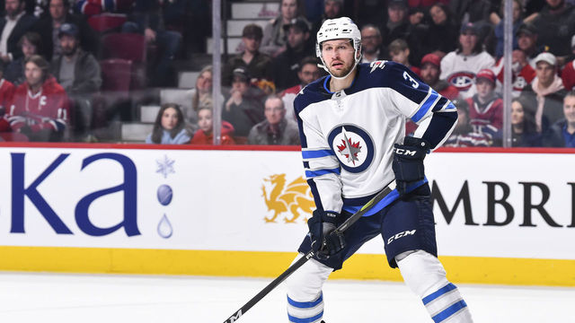 MONTREAL, QC - APRIL 03: Tucker Poolman #3 of the Winnipeg Jets looks on against the Montreal Canadiens during the NHL game at the Bell Centre on April 3, 2018 in Montreal, Quebec, Canada. The Winnipeg Jets defeated the Montreal Canadiens 5-4 in overtime.