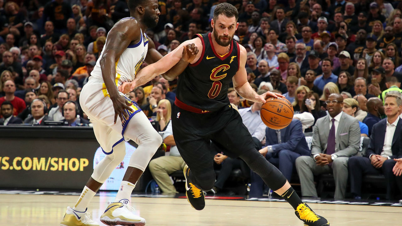 CLEVELAND, OH - JUNE 08: Kevin Love #0 of the Cleveland Cavaliers drives to the basket against Draymond Green #23 of the Golden State Warriors during Game Four of the 2018 NBA Finals at Quicken Loans Arena on June 8, 2018 in Cleveland, Ohio.