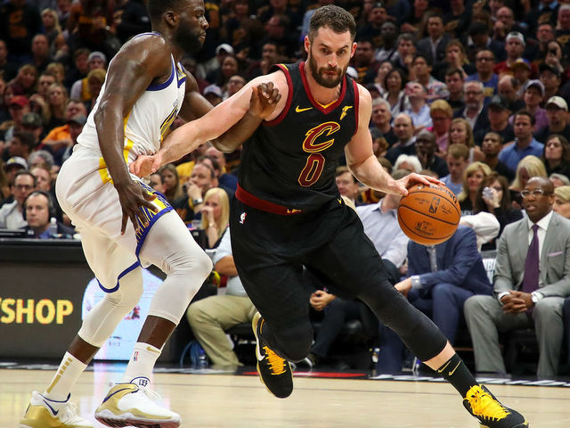 CLEVELAND, OH - JUNE 08: Kevin Love #0 of the Cleveland Cavaliers drives to the basket against Draymond Green #23 of the Golden State Warriors during Game Four of the 2018 NBA Finals at Quicken Loans Arena on June 8, 2018 in Cleveland, Ohio.