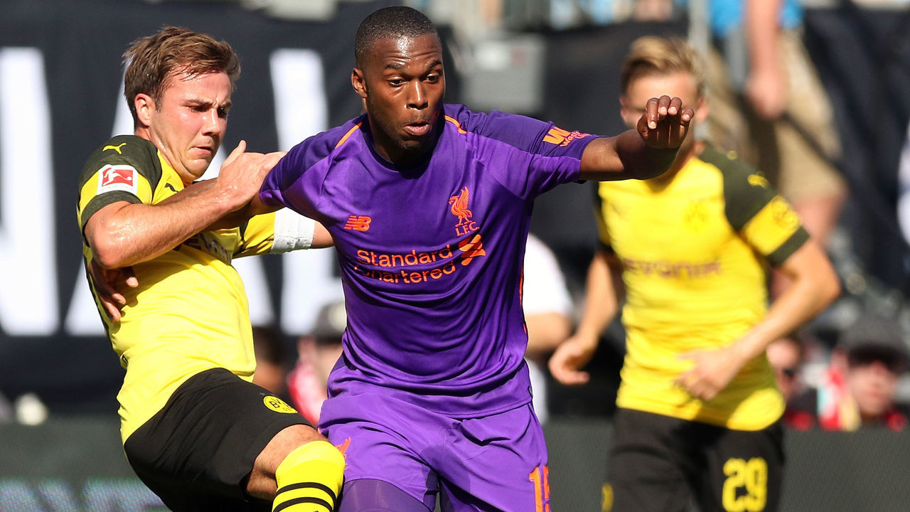 CHARLOTTE, NC - JULY 22: Daniel Sturridge #15 of Liverpool pushes away Mario Gotze #10 of Borussia Dortmund to control the ball during an International Champions Cup match at Bank of America Stadium on July 22, 2018 in Charlotte, North Carolina.